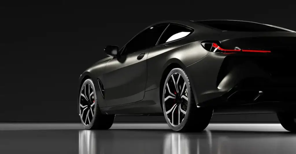 Black-car-in-showroom-Dynamax-Wraps
